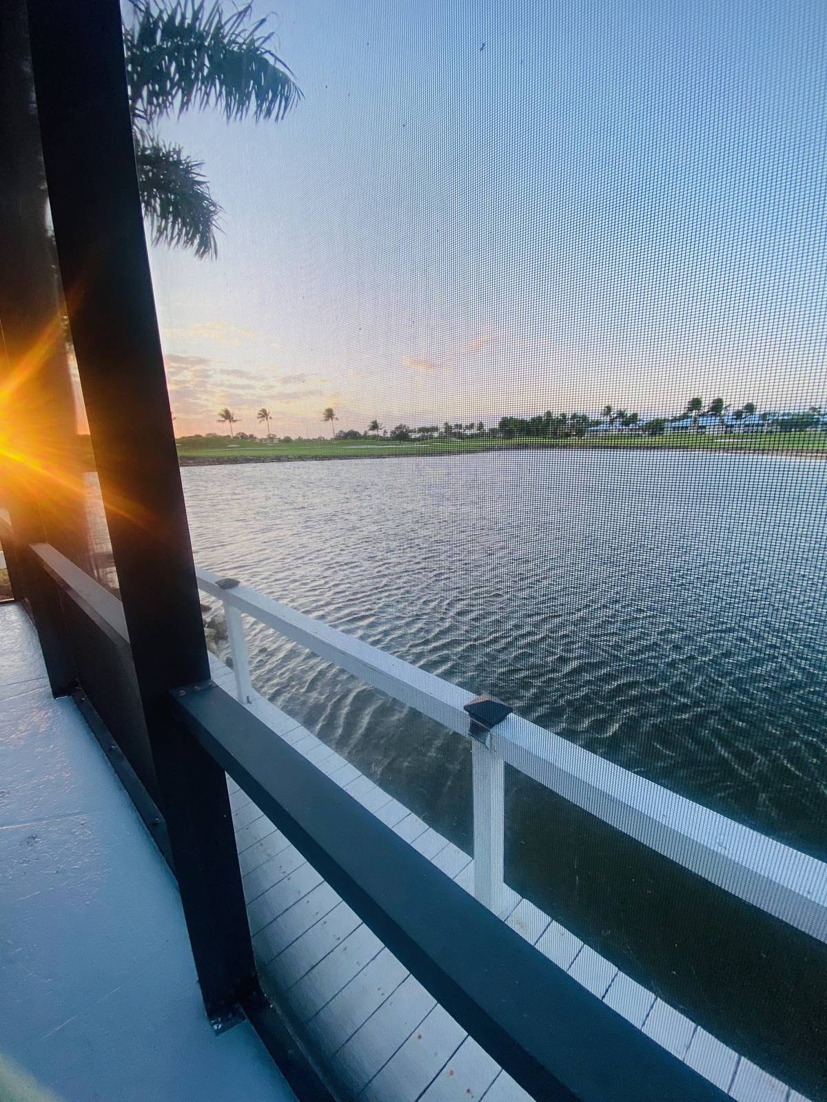 Nave-a-Lago — Lanai outlook across the lake at sunset
