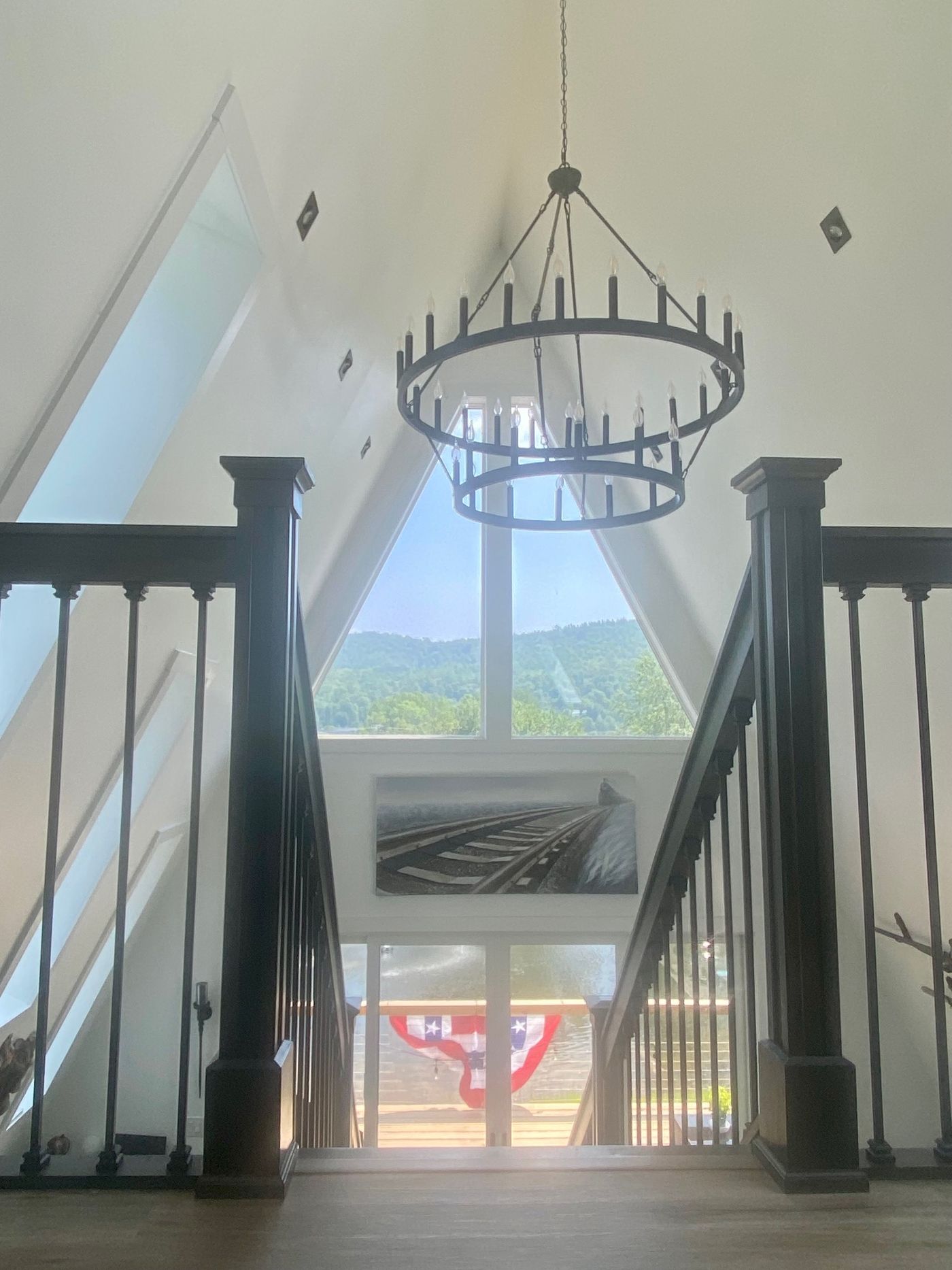 Reflection Ridge — Chandelier stairwell with mountain view