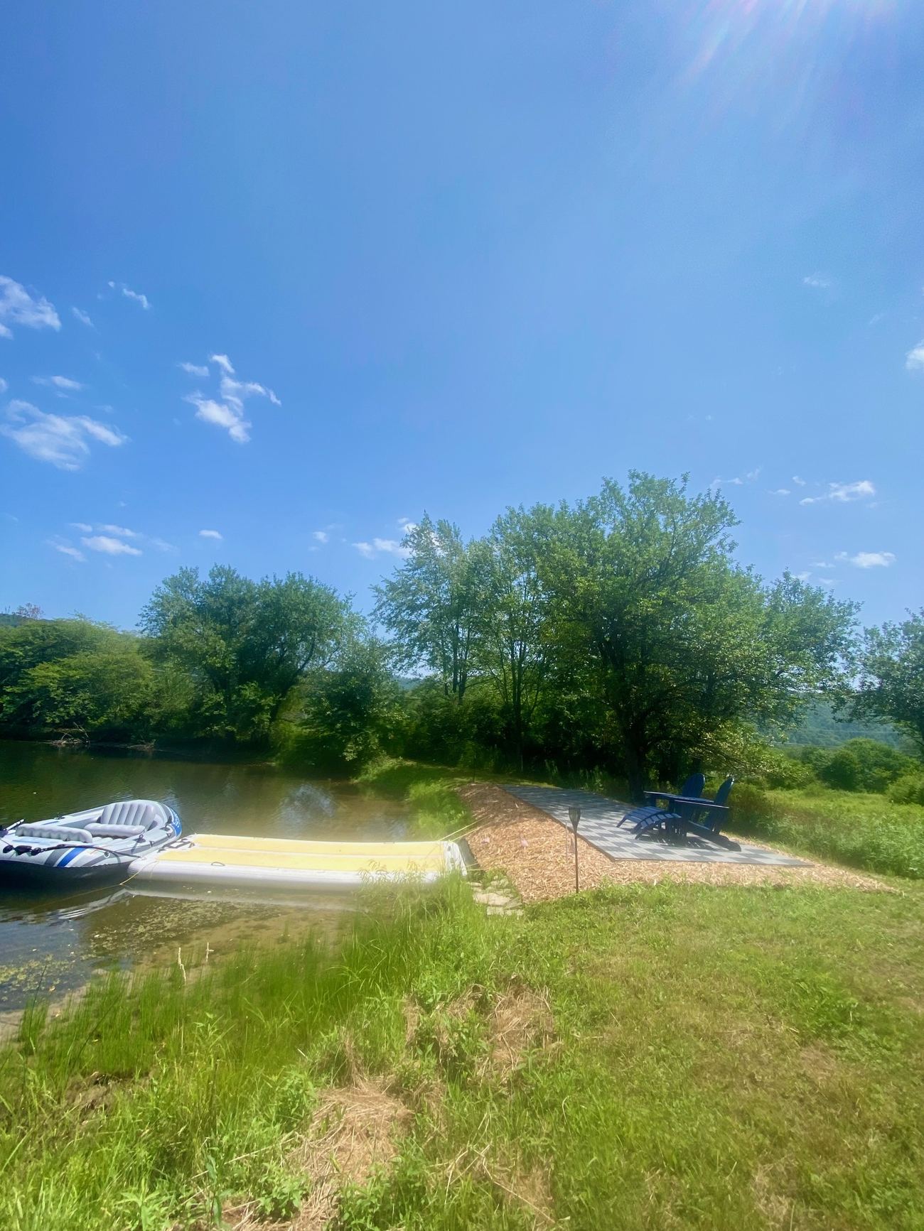 Reflection Ridge — Dock, boat and lakeside chairs