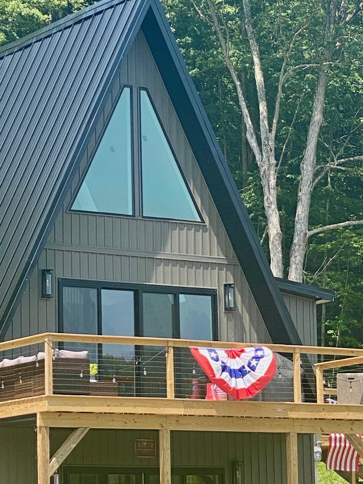 Reflection Ridge — A-frame front with mountain glass